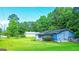 Charming home with a well-kept lawn, featuring a one-car garage and cozy front porch at 1183 Iron Gate Blvd, Jonesboro, GA 30238
