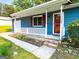 Inviting front porch with white lattice railing, brick steps, and a cozy entrance at 1183 Iron Gate Blvd, Jonesboro, GA 30238