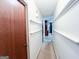 Hallway with neutral walls and shelf molding at 1183 Iron Gate Blvd, Jonesboro, GA 30238