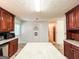 Bright kitchen featuring a large island with granite countertops and tile floors at 1183 Iron Gate Blvd, Jonesboro, GA 30238