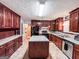 Spacious kitchen featuring ample cabinetry, countertop space, and an island at 1183 Iron Gate Blvd, Jonesboro, GA 30238