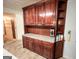 Kitchen nook includes elegant cherry wood cabinets, and spacious countertops at 1183 Iron Gate Blvd, Jonesboro, GA 30238