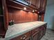 Kitchen countertop with upper cabinets and beadboard backsplash at 1183 Iron Gate Blvd, Jonesboro, GA 30238