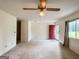 Large living room with ceiling fan and access to the exterior at 1183 Iron Gate Blvd, Jonesboro, GA 30238