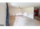 Bright living room with neutral walls, ceiling fan, and carpet at 1183 Iron Gate Blvd, Jonesboro, GA 30238