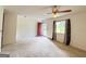 Spacious living room featuring a ceiling fan and exterior access at 1183 Iron Gate Blvd, Jonesboro, GA 30238