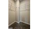 Walk-in closet with carpeted floor and shelving units, providing ample storage space at 1317 Rosemary Ln # 65, East Point, GA 30344