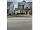 Charming two-story home with light brick and manicured lawn; perfect for curb appeal at 1317 Rosemary Ln # 65, East Point, GA 30344