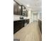 Modern kitchen featuring dark cabinets, stainless steel appliances, light countertops and elegant flooring at 1317 Rosemary Ln # 65, East Point, GA 30344