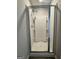 Step-in shower in bathroom with built-in shelves and a sleek glass door at 1317 Rosemary Ln # 65, East Point, GA 30344