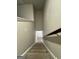 Carpeted stairs lead to the lower level, providing safe and comfortable access at 1317 Rosemary Ln # 65, East Point, GA 30344