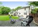 Backyard patio with gravel fire pit and Adirondack chairs at 407 Calgary Dr, Peachtree City, GA 30269