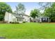 Open backyard featuring a storage shed, patio, and well-manicured lawn at 407 Calgary Dr, Peachtree City, GA 30269