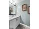Bathroom featuring granite countertop, tile floors, and grey walls at 407 Calgary Dr, Peachtree City, GA 30269