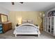 Bedroom with painted yellow walls, decorative furniture, shelving and modern lighting at 407 Calgary Dr, Peachtree City, GA 30269