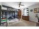 Bedroom with bunk bed with sports court, ceiling fan, and a striped window at 407 Calgary Dr, Peachtree City, GA 30269