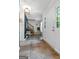 Bright foyer featuring wood floors, elegant lighting, and a staircase with wooden rails at 407 Calgary Dr, Peachtree City, GA 30269