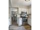 Kitchen with stainless oven and microwave plus view into the dining room at 407 Calgary Dr, Peachtree City, GA 30269