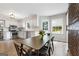 Bright kitchen with stainless appliances and an eat-in kitchen area at 407 Calgary Dr, Peachtree City, GA 30269