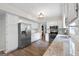 Bright kitchen features stainless appliances, granite countertops, and hardwood floors at 407 Calgary Dr, Peachtree City, GA 30269