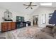 Sunroom featuring vaulted ceilings, fan, and view to kitchen at 407 Calgary Dr, Peachtree City, GA 30269