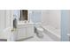 Bathroom with white vanity, toilet, tub with tile surround, and blue walls at 795 Lake Medlock, Alpharetta, GA 30022