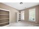 Neutral bedroom with two windows and built in shelving offering ample space at 795 Lake Medlock, Alpharetta, GA 30022