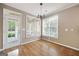 Charming breakfast nook with hardwood floors, natural light, and a door leading to outdoor at 795 Lake Medlock, Alpharetta, GA 30022
