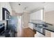 Kitchen featuring stainless steel appliances, granite countertops, white cabinets, and hardwood flooring at 795 Lake Medlock, Alpharetta, GA 30022
