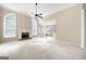 Spacious living room with fireplace, high ceilings, large windows, and an open layout perfect for entertaining at 795 Lake Medlock, Alpharetta, GA 30022