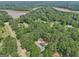 Aerial view of property with above ground pool, house, and view of lake in distance at 130 Emerald Dr, Mcdonough, GA 30253