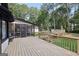Spacious back deck featuring access to the sunroom, pool, and backyard at 130 Emerald Dr, Mcdonough, GA 30253