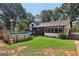 Exterior view showcasing the yard, screened in porch, and inviting in-ground pool with a deck at 130 Emerald Dr, Mcdonough, GA 30253