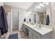 Modern bathroom with a double vanity, shower and tile floor at 130 Emerald Dr, Mcdonough, GA 30253