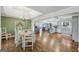 Open-concept dining area connected to the kitchen with hardwood floors and ample natural light at 130 Emerald Dr, Mcdonough, GA 30253