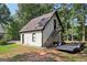 Exterior view of a home and garage, highlighting the architecture and access to upper level at 130 Emerald Dr, Mcdonough, GA 30253