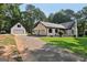 Charming brick home with well-maintained lawn and a detached garage offering ample space at 130 Emerald Dr, Mcdonough, GA 30253