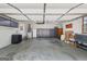 Spacious garage with storage, ceiling fans, American flag, and ample room for projects and parking at 130 Emerald Dr, Mcdonough, GA 30253