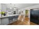 Open-concept kitchen with stainless steel appliances and a spacious island with bar seating at 130 Emerald Dr, Mcdonough, GA 30253