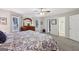 Comfortable main bedroom with a king bed, dresser with mirror, and neutral walls and carpeting at 130 Emerald Dr, Mcdonough, GA 30253