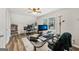 This home office features a large window, modern desk, and updated flooring at 130 Emerald Dr, Mcdonough, GA 30253