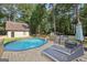 Inviting in-ground pool surrounded by a spacious wooden deck, ideal for outdoor relaxation and entertaining at 130 Emerald Dr, Mcdonough, GA 30253