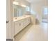 Bathroom featuring double vanity, tile floor, and large bathtub at 3468 Jasmine Sw Way, South Fulton, GA 30331