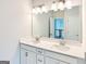 New bathroom with double vanity and large mirror with great lighting and a neutral color palette at 3468 Jasmine Way Sw, South Fulton, GA 30331