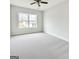 Bedroom featuring carpet, a window, and neutral walls at 3468 Jasmine Sw Way, South Fulton, GA 30331