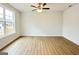 Bright and spacious bedroom featuring a ceiling fan, wood-look floors, and a window with natural light at 3468 Jasmine Way Sw, South Fulton, GA 30331