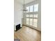 Living room with a fireplace and floor to ceiling windows at 3468 Jasmine Sw Way, South Fulton, GA 30331