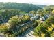 An aerial view of townhomes surrounded by lush greenery, showcasing the community setting at 1602 Riverbend Club Drive, Atlanta, GA 30339
