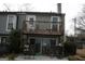 Inviting backyard space with a patio, outdoor seating, and a charming wooden fence at 1602 Riverbend Club Drive, Atlanta, GA 30339