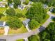 This aerial view shows the roof and trees surrounding the property at 305 Overland Trl, Temple, GA 30179